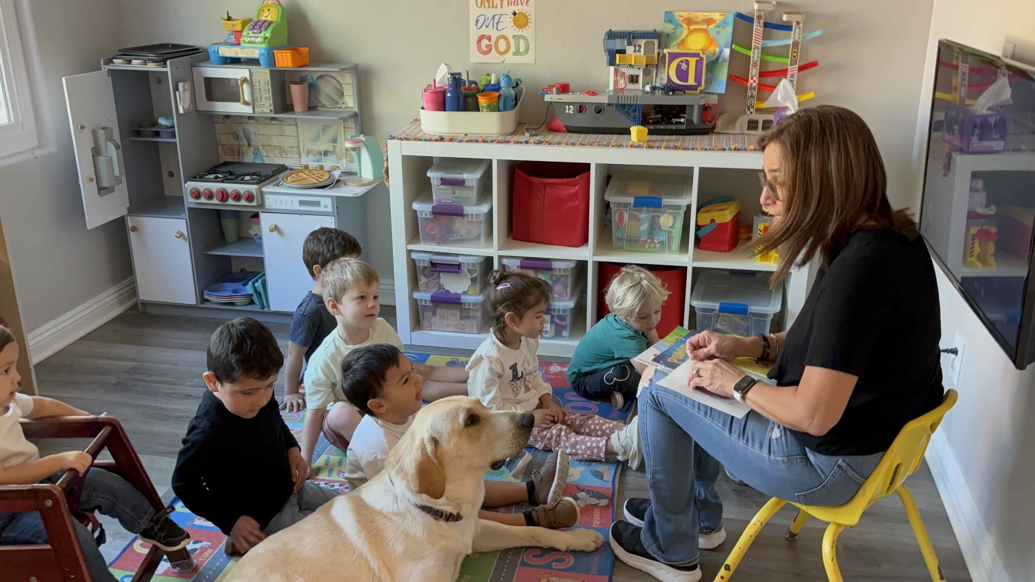The cozy story carpet where circle time and Bible stories happen at Ms. Rena's Preschool